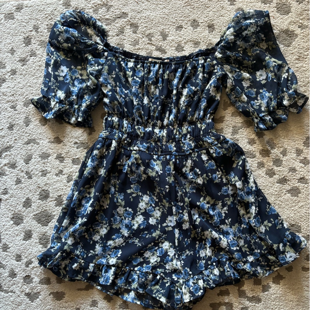 Blue floral altered state romper off the shoulder.